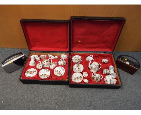 A wooden cased six place Japanese porcelain coffee / tea service decorated with Geisha girls and a pair of Roberts radios mod