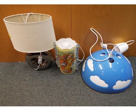 A good collection of lamps to include a silver coloured table lamp with shade, a child's bedroom lamp depicting Tigger and Wi