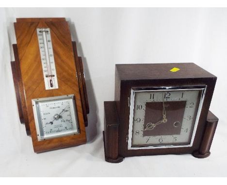 An Art Deco mahogany cased mantel clock by Smiths of Enfield, 19 cm (h) and an Art Deco wall mounted barometer, 30 cm (h) x 1