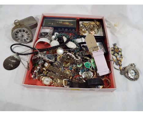 A good mixed lot to include a white metal wind-up gold fired alarm clock, a quantity of wristwatches to include Limit, Avia, 