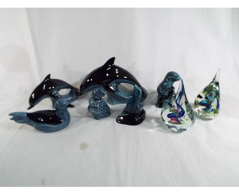 A collection of six Poole Pottery figurines to include a dolphin, an otter, a seal, a door mouse and a duck included in the l