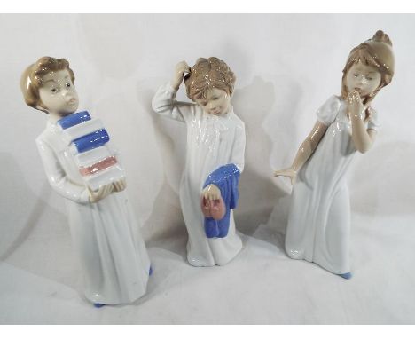 Three Nao by Lladro figurines depicting children, generally 29 cm (h) (3)