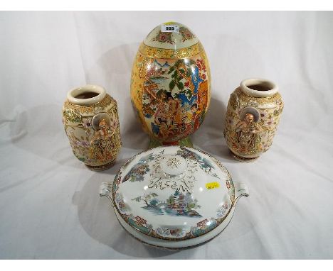 A large unusual Japanese ceramic egg with relief decoration and gilded highlights, 32cm (h) and a pair of Japanese vases with