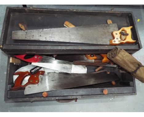 A wooden chest containing a quantity of vintage hand tools 18 cm x 77 cm x 36 cm