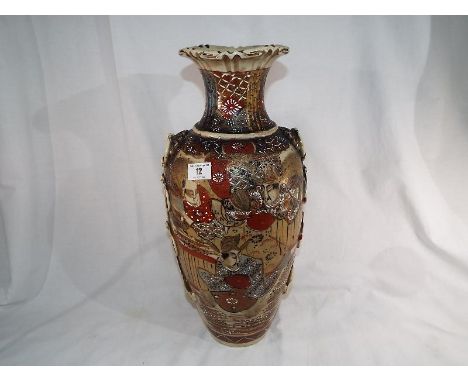 A good quality early 20th century ceramic Japanese vase with relief decoration, signed to the base, 46cm (h)