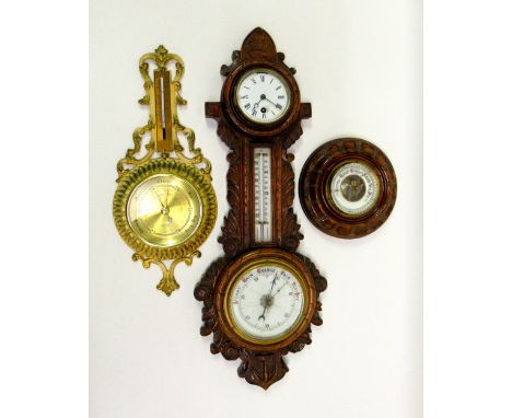 LATE VICTORIAN WHEEL BAROMETER, THERMOMETER AND TIMEPIECE IN A CARVED OAK CASE (H: 65cm), BAROMETER AND THERMOMETER IN A CREA