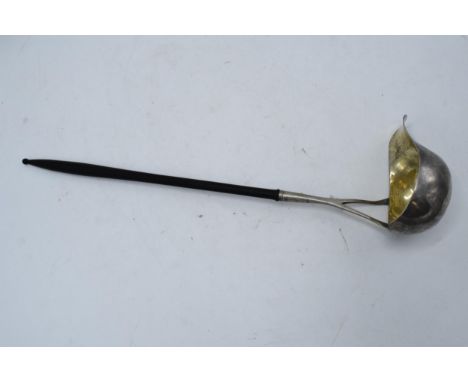 A 19th century Scandinavian silver ladle with ebonised wooden handle. 39cm long. 