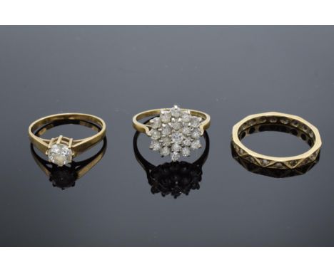 Three 9ct gold rings ? white stone cluster UK size O, single white stone size N/O and eternity size R. 5.7g 