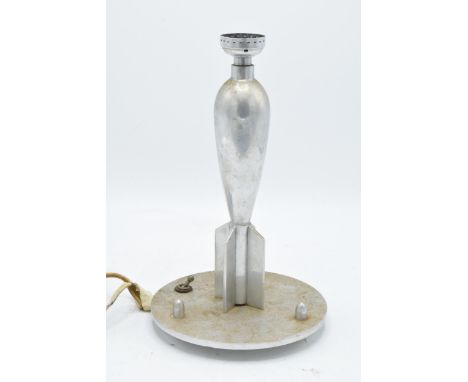A 20th century scratch built table lamp in the form of a rocket/ torpedo style item. 25cm tall. Untested. Will need re-wiring