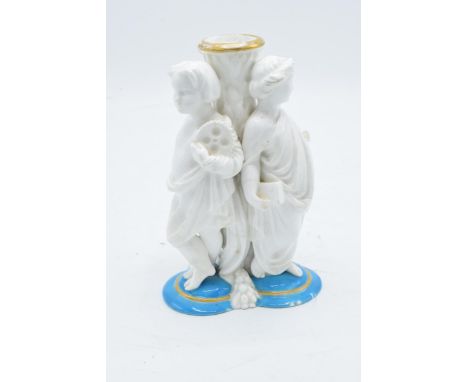 Late 19th century Continental porcelain candlestick or similar item depicting cherubs wearing robes (a/f). 15cm tall. Chippin