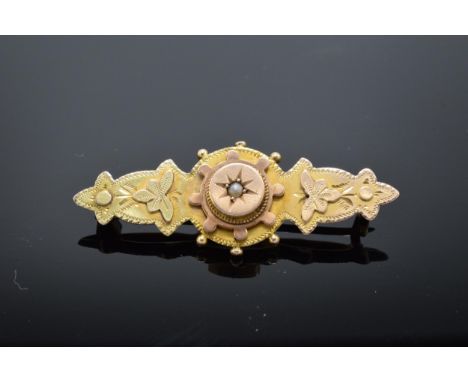 9ct gold ladies sweetheart brooch set with a seed pearl with floral decoration (base metal pin). Total weight 2.7 grams. 