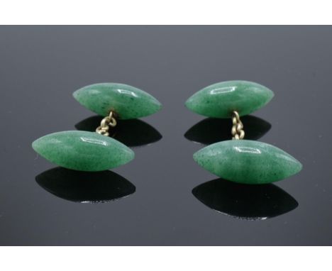 A pair of jade or similar hard stone cufflinks. 