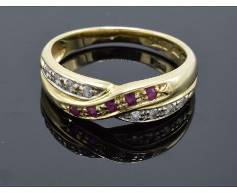 A 14ct gold ladies ring set with diamonds and ruby stones. UK size N/O. Gross weight 3.1 grams. Marked 585. 