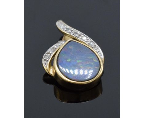 A 9ct gold pendant set with opal stone and illusion set diamonds. 1.0 grams. 