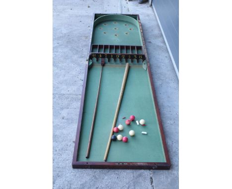 A 19th century folding table-top bagatelle in a mahogany case with green felt interior by Thurston and Co of 14 Catherine Str