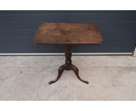 A 19th century oak tripod table. 72cm tall. In good functional condition though as expected are showing signs of use and wear