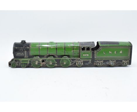 A tin plate model of a locomotive / steam train with tender 'The Flying Scotsman'. Sold as a decorative piece. With age relat