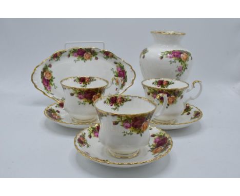 A collection of Royal Albert items in the Old Country Roses design to include 3 breakfast cups and saucers, a serving tray an