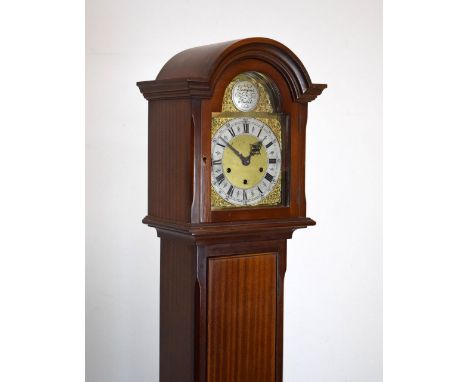Early 20th Century mahogany cased striking and chiming grandmother clock having brass arched dial with strike silent feature,