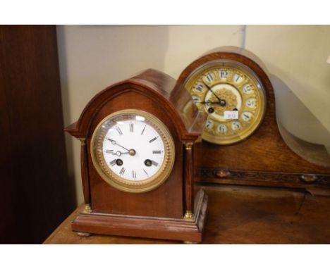 Two early 20th Century mantel clocks comprising a lancet-arch mahogany example with two train movement, 20cm high, and an oak