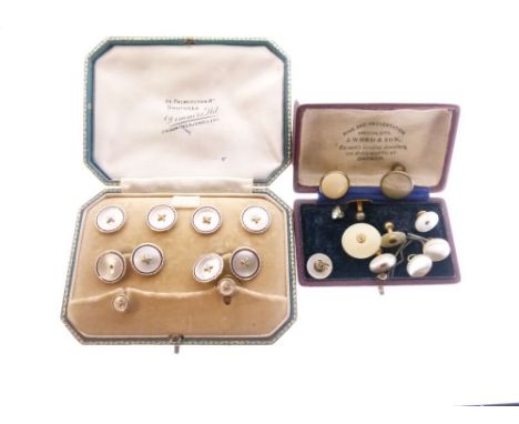 Two cased sets of collar studs, both in mother-of-pearl, one with blue enamel borders  