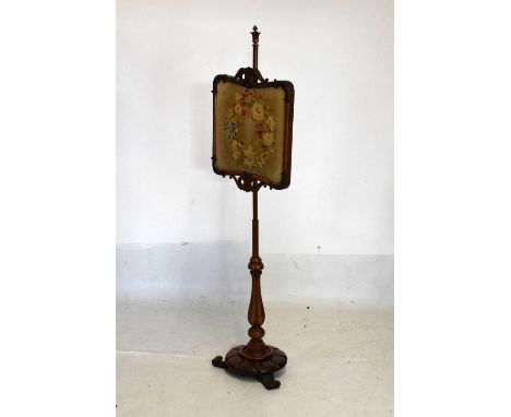Early 19th Century rosewood polescreen having needlework panel and tripod base, 148cm high  
