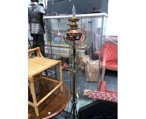A VICORIAN IRON AND BRASS STANDARD LAMP