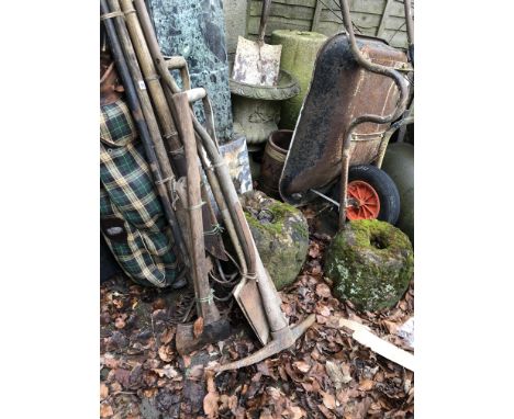 A WHEELBARROW AND VARIOUS GARDEN TOOLS. 