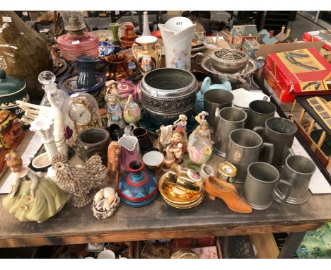 AN OIL LAMP, PEWTER MUGS, HUMMELL AND OTHER FIGURES, A ROTARY CLOCK UNDER DOME, LUSTRE WARES, ETC.
