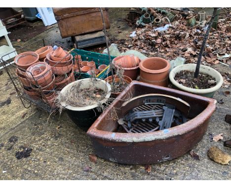 A STONEWARE PEDESTAL, A QUANTITY OF PLANT POTS, A BROWN GLAZED CORNER SINK AND A FIRE GRATE