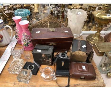 A COPPER GRADED SET OF MEASURES, BRASS FIRE IRONS, ELECTROPLATE CUTLERY, CAMERAS, A TEA CADDY AND GLASS WARES