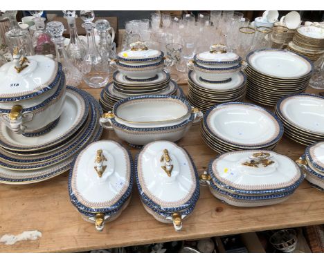 A ROYAL WORCESTER BLUE GUILLOCHE BORDERED DINNER SERVICE 