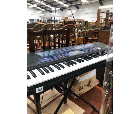 A CASIO KEYBOARD AND STAND