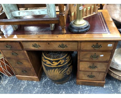 AN ANTIQUE WALNUT TWIN PEDESTAL DESK
