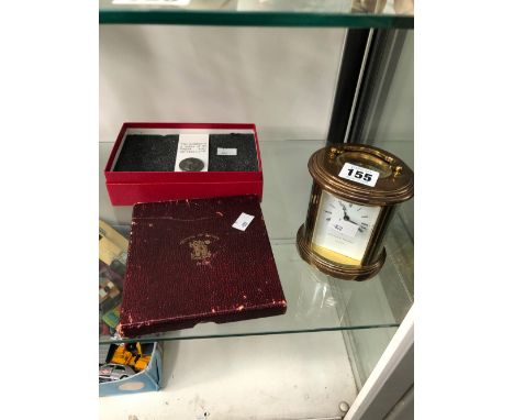 A CASED SET OF FESTIVAL OF BRITAIN COINS, A REPLICA ARMY PAY TOKEN AND A MATTHEW NORMAN OVAL CARRIAGE CLOCK