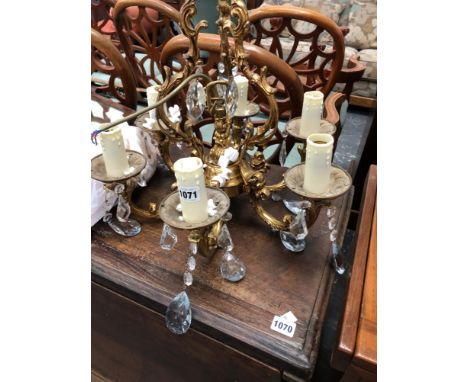 A SMALL GILT BRASS SIX LIGHT CHANDELIER 