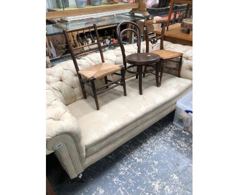 A VICTORIAN BUTTON BACK CHESTERFIELD SOFA ON CERAMIC CASTORS. H 67 W 95 D 90 cm