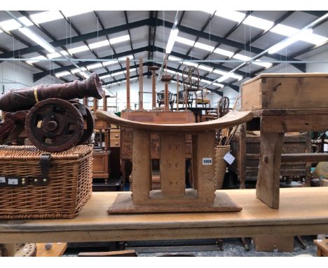 A VINTAGE ASHANTI STOOL, A RUSTIC PINE STOOL A PINE BOX, WHICKER HAMPER AND A MODEL CANNON.
