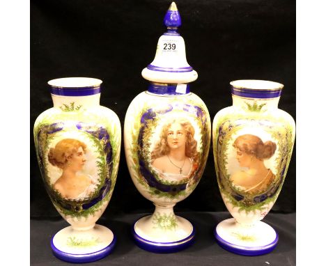 A set of three Victorian pink glass cameo vases with blue and gilt highlights each with the portrait of a young lady, tallest