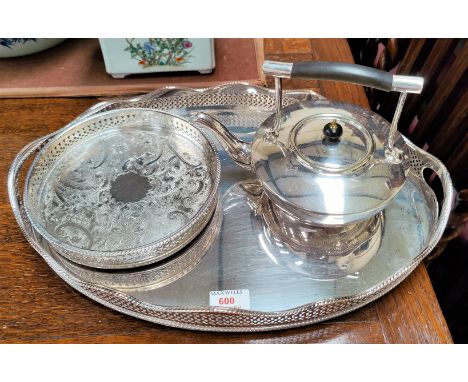 A large silver plate on copper oval gallery tray with pierced border, a small circular silver plated gallery tray and a silve