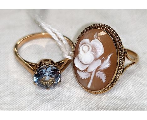 A 9 carat hallmarked gold rose cameo ring, size M/N; a 9 carat hallmarked gold ring set blue stone, 5.5 gm, size O 