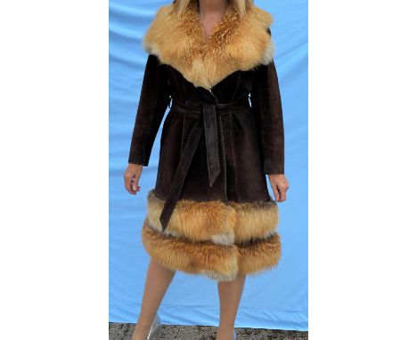 A vintage dark brown suede coat with tie belt, fox fur collar and detachable fox fur band at the bottom, with matching fur ha