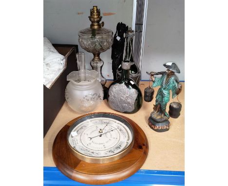 A circular aneroid barometer; a glass oil lamp; 2 pewter mounted glass bottles; etc.&nbsp;&nbsp;It is fairly modern with moul