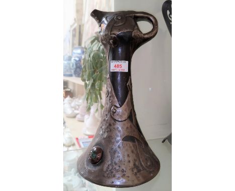 A Bretby ceramic jug in the manner of an Arts and Crafts copper jug number 1612 ht 33cm 