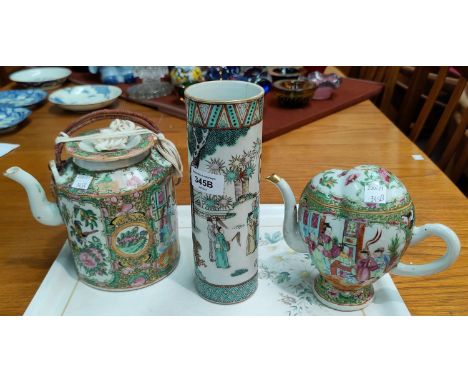 A Chinese famille verte tea pot decorated with panels of traditional scenes of birds and insects etc, of base filling design,