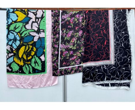 An ESCADA large silk square scarf, pink ground with green, black, yellow and turquoise pattern, another black floral print, a