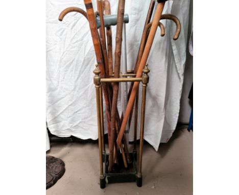 A brass stick stand and sticks 