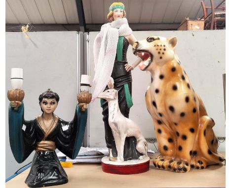 An Art Deco style figure of a 'flapper', 65 cm; a plaster figure of a leopard, 50 cm; a similar lamp 