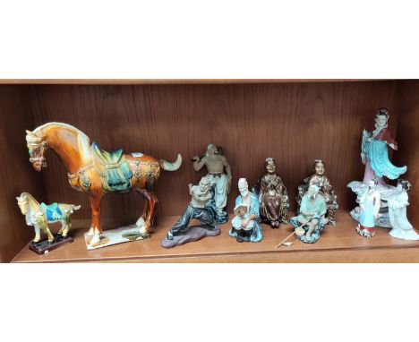 A selection of 20th century Chinese ceramic figures including immortals, martial artist, Tang style horses etc.Large horse in