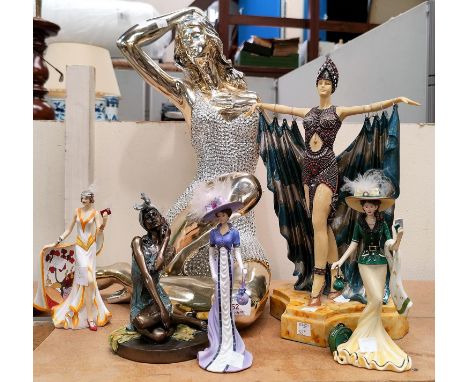 A 1970's style silvered figure of a woman, 52 cm; an Art Deco figure by Leonardo; and others 